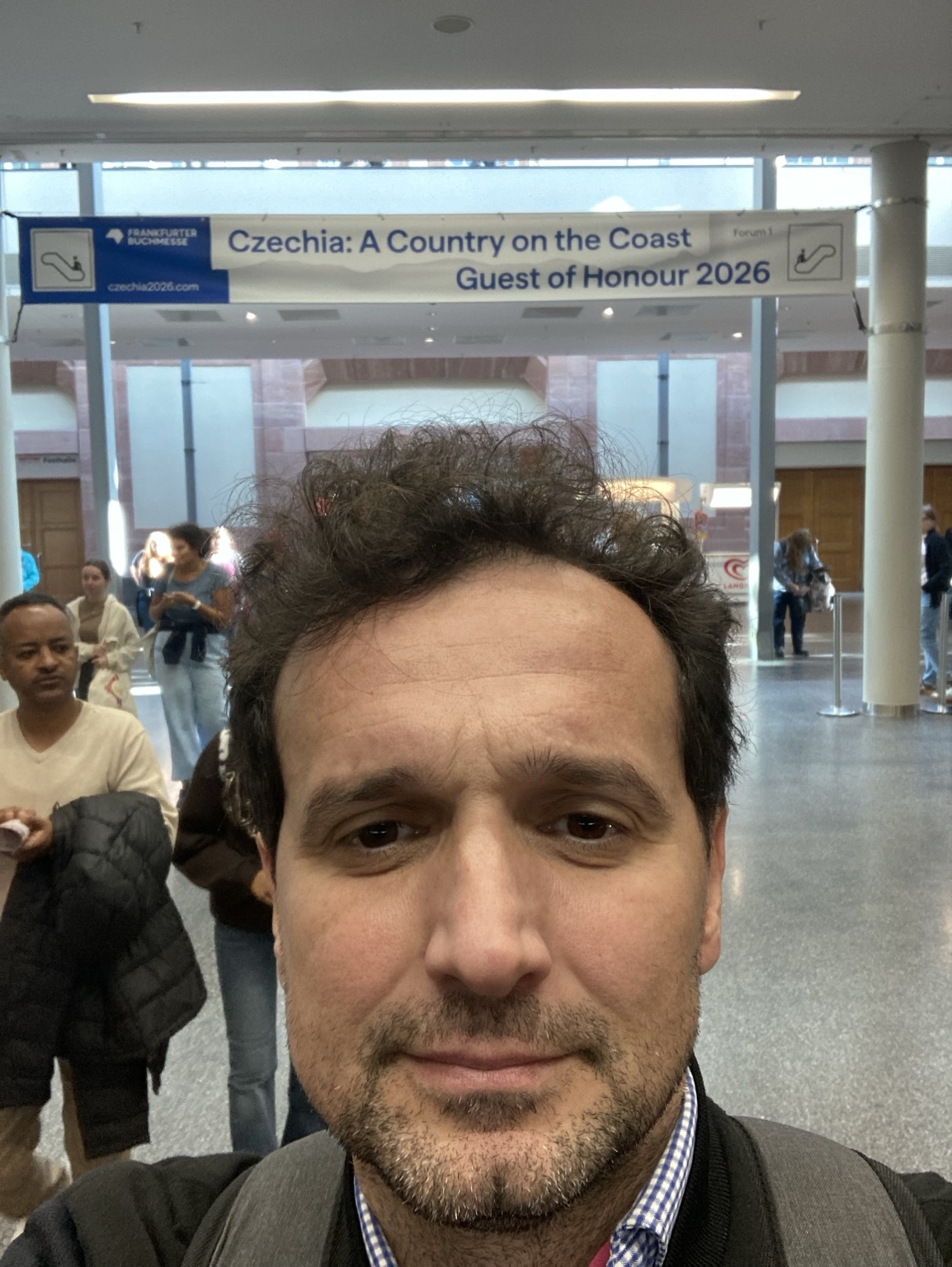 Peter Ulcin at Frankfurt Book Fair beneath the Czechia Guest of Honour 2026 sign